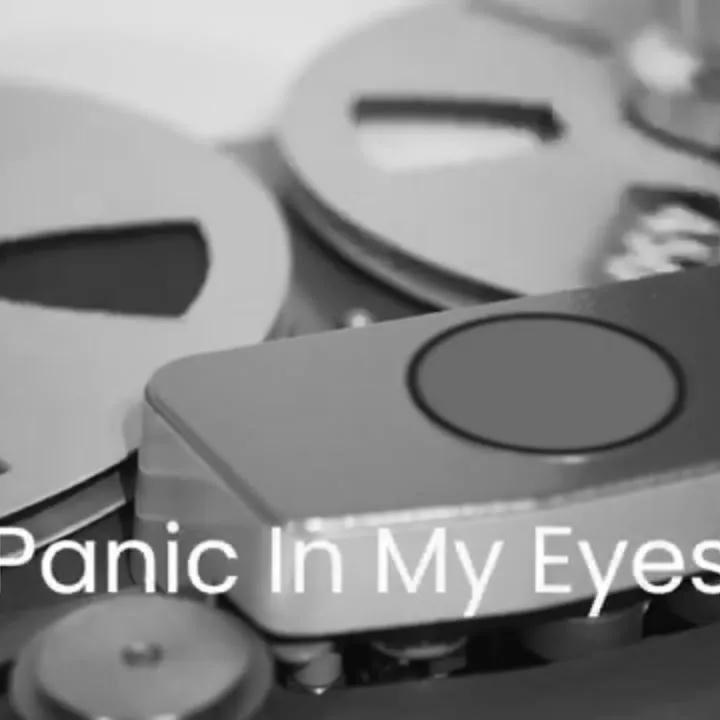 Black and white photo of quarter inch reel to reel with Ampex 456 tape loaded.